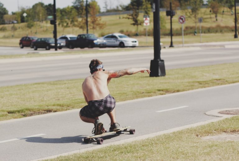 Rider cruising on a longboard on an open road